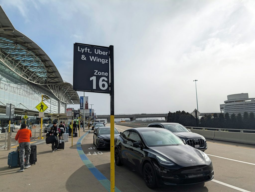 A car parked in front of an airport
